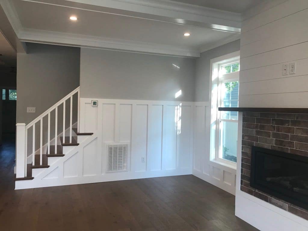 Stair and board-and-batten wall beside the fireplace