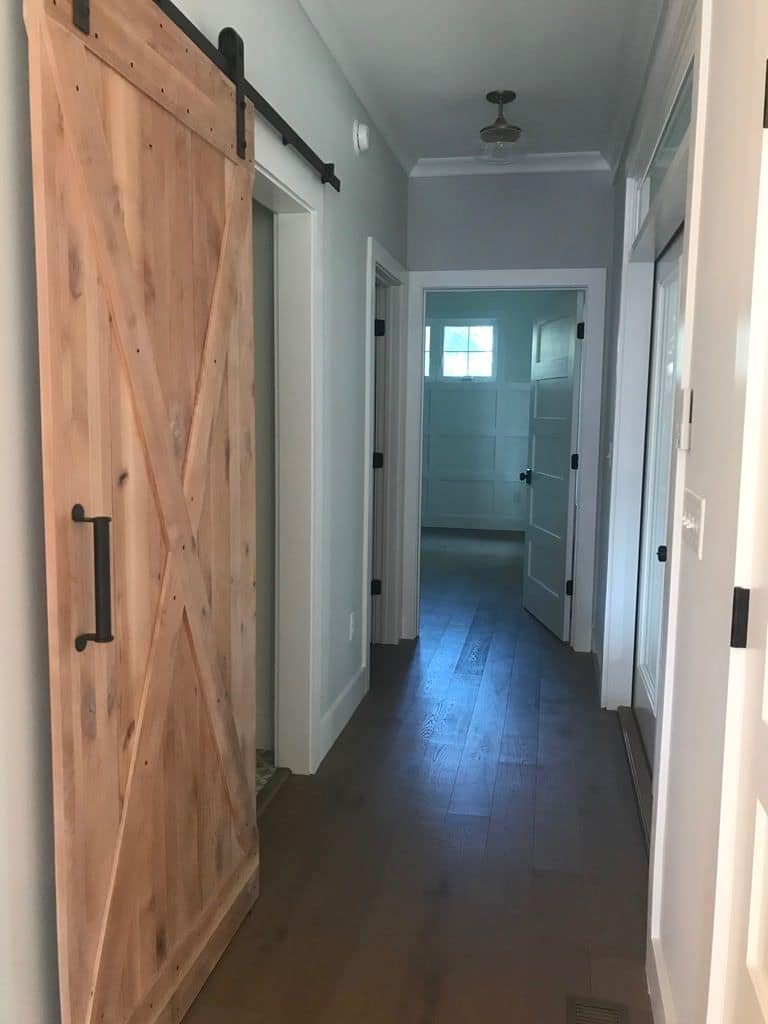 Hallway with a sliding barn door