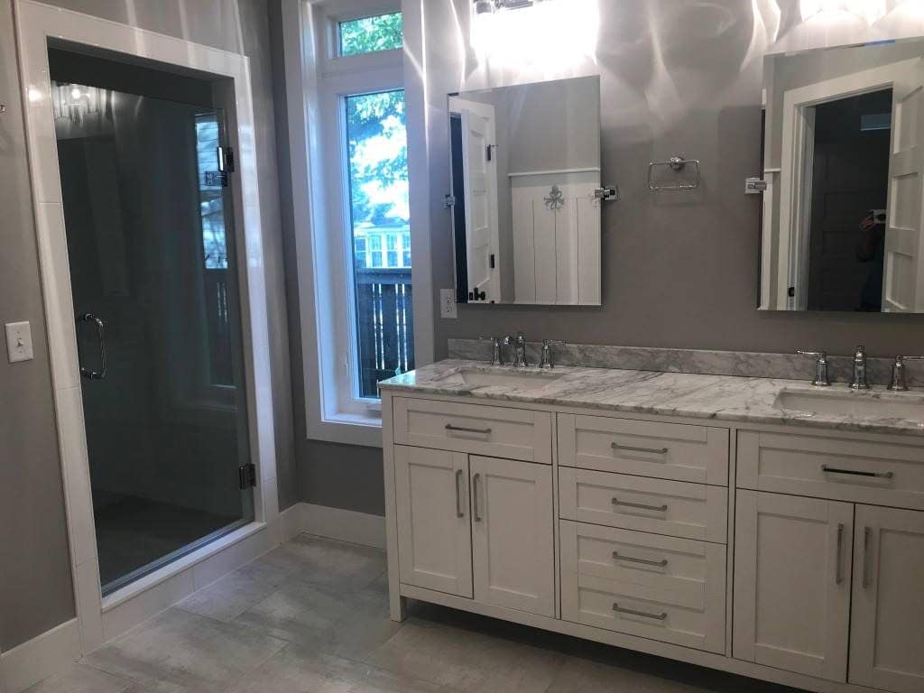 Primary bath with a double vanity and marble top