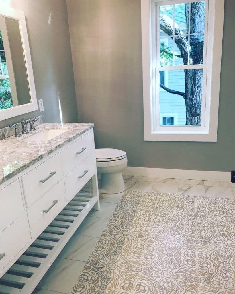 Bath vanity over a patterned tile floor